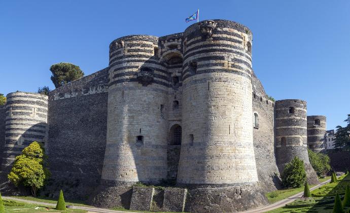 a stone castle with a flag on top